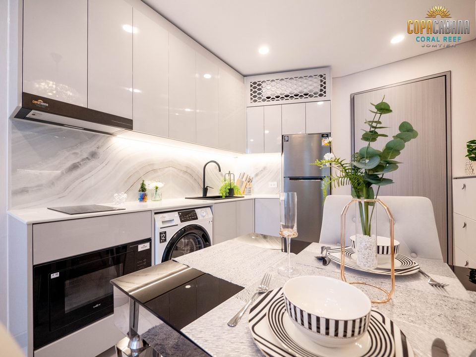 Copacabana Coral Reef Type 4 show-unit kitchen and dining area with branded appliances, real photograph